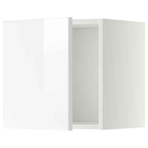 A white modern kitchen cabinet from IKEAs METOD system with glossy doors.