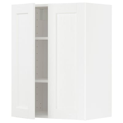 A white METOD kitchen cabinet with one door open, revealing adjustable shelves, and one door closed.