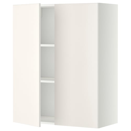 A white METOD wall cabinet with two open doors revealing an adjustable shelf inside.