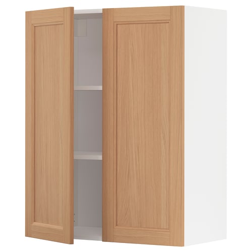 An open oak wooden kitchen cabinet from the METOD system, featuring two doors and an adjustable shelf.