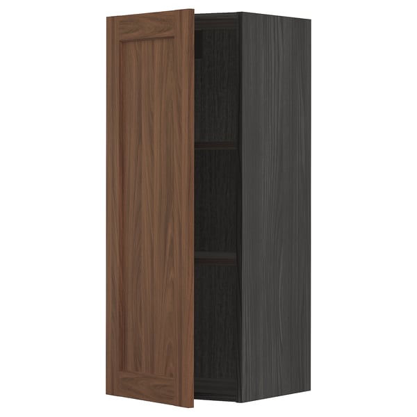 A METOD kitchen wall cabinet with a brown walnut door.
