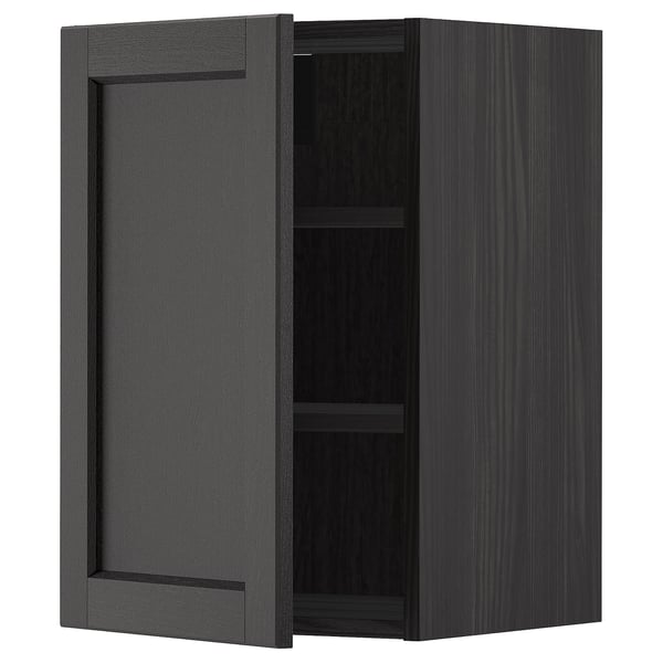 Black stained wooden kitchen cabinet with one adjustable shelf and bevelled door edges.