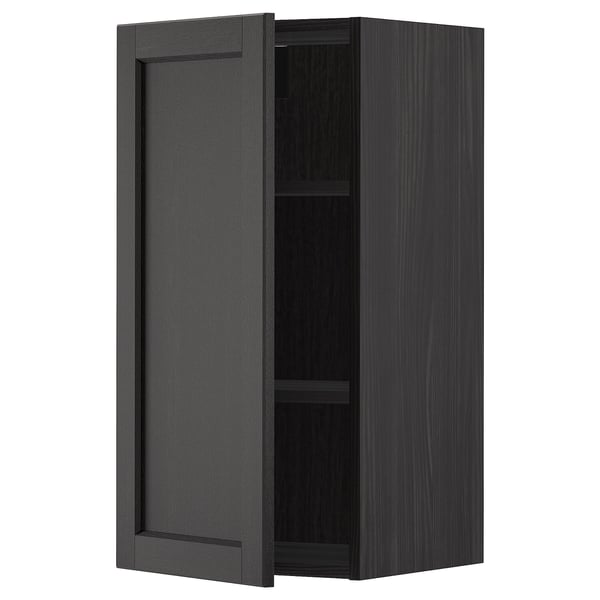 Black stained wooden kitchen cabinet with single door and adjustable shelf.