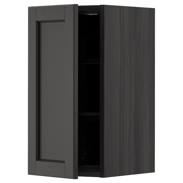 Black stained wooden kitchen wall cabinet with single door and adjustable shelf.