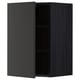 Black METOD wall cabinet with open door showcasing shelves, modern kitchen design.