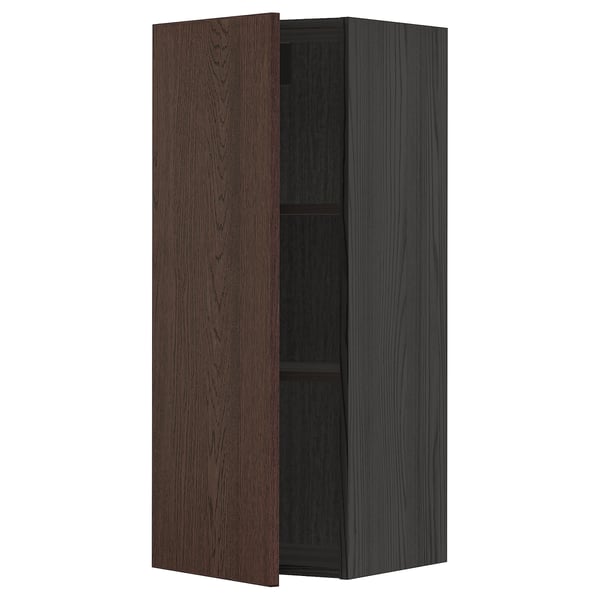A dark brown and black kitchen cabinet with a door open, revealing an adjustable shelf inside.
