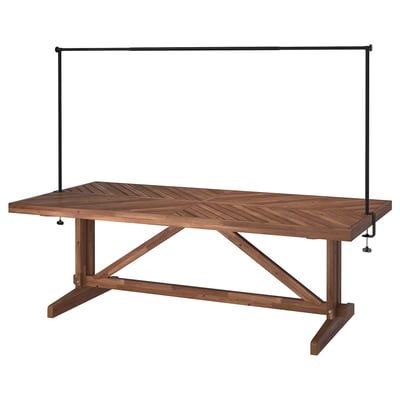 NORRMANSÖ acacia outdoor table with metal decorating rod.