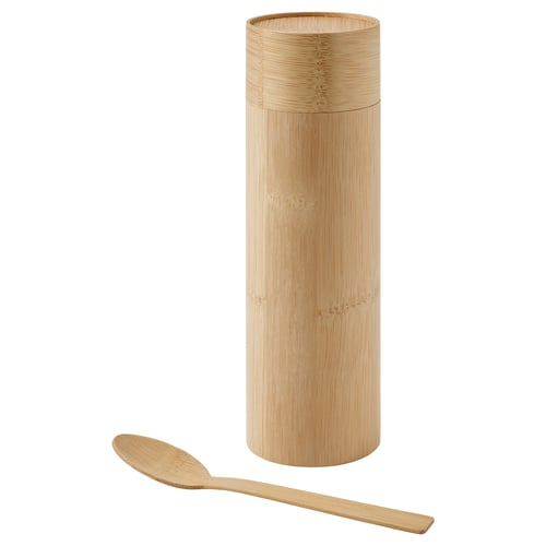 A bamboo container with a matching spoon. It’s cylindrical, light brown, and has a lid. Perfect for tea or coffee.
