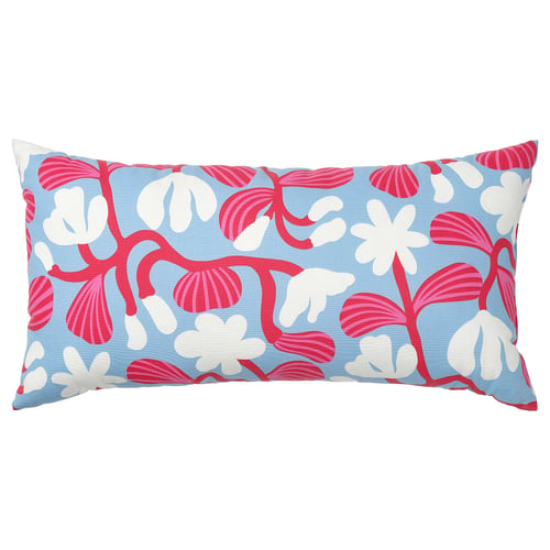 A long, rectangular pillow with blue background, red and white flower patterns, and a scandinavian design.
