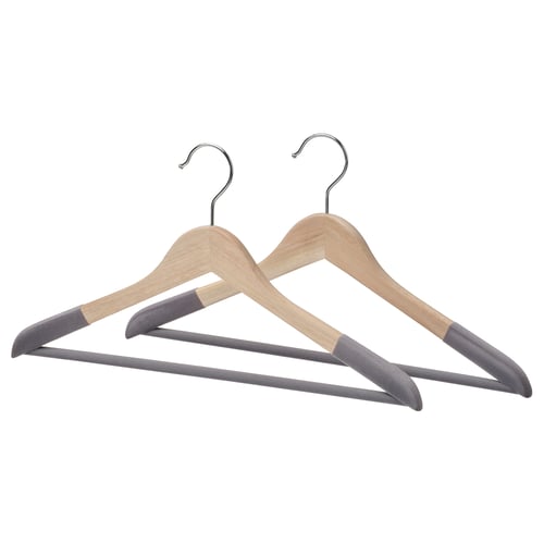 Pair of wooden hangers with grey flocked tips and metal hooks.