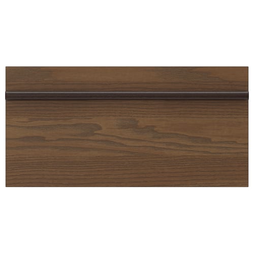 A dark brown ash veneer kitchen cabinet front with a long, solid wooden handle spanning its width, offering a sleek, linear design.