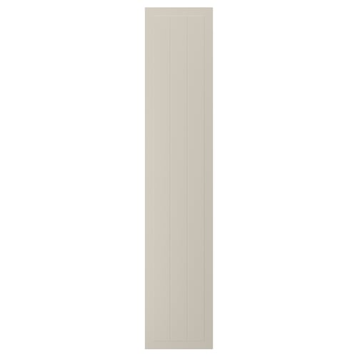 A beige STENSUND cabinet door with grooved panels in a rectangular shape.