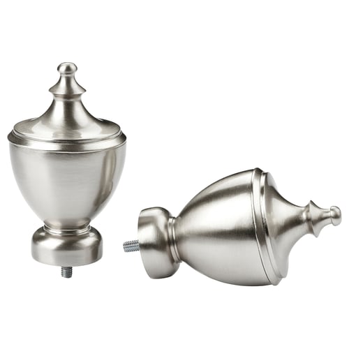 Silver trophy-shaped finials from different angles.