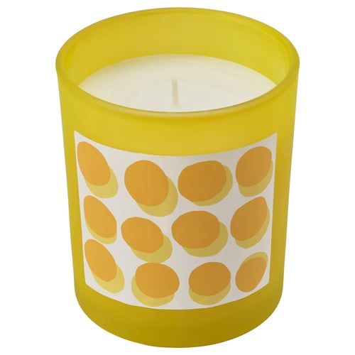 SVARTOXBÄR yellow candle, frosted glass with orange dots, fresh mimosa scent.
