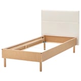Minimalist TÄRNKULLEN bed frame in beige, light wood, rectangular shape with padded headboard.