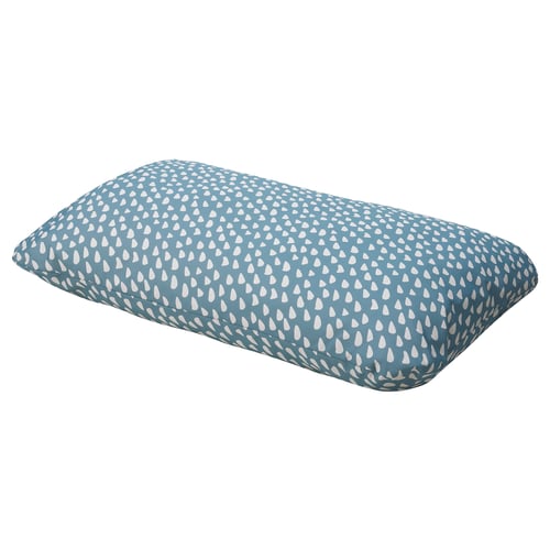 The UTSÅDD dog cushion, blue with white teardrop shapes, is rectangular and durable, providing comfort for pets.