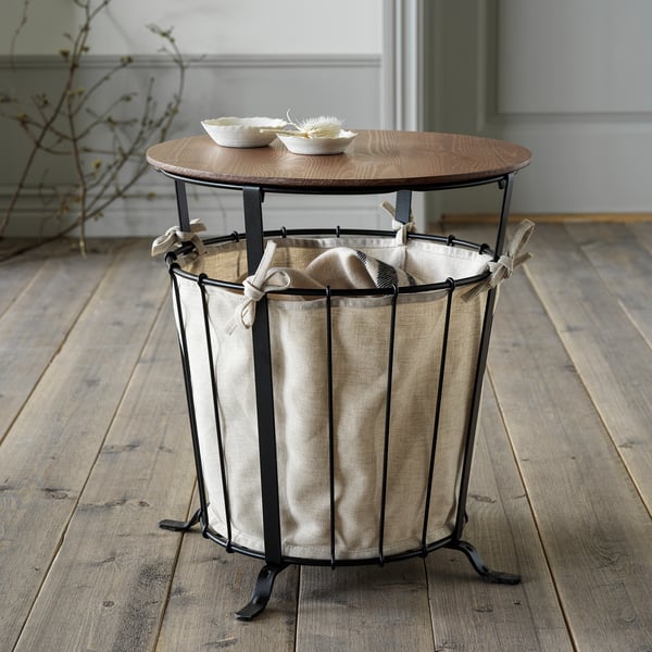 Taula d'emmagatzematge Ängsby: tapa de fusta, bossa de tela, base metàl·lica, perfecta per a habitacions, combina natura i modernitat.