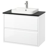 Moble de bany blanc modern amb taulell negre i lavabo quadrat. De paret amb dos calaixos. Acabat d'alta brillantor i disseny minimalista.
