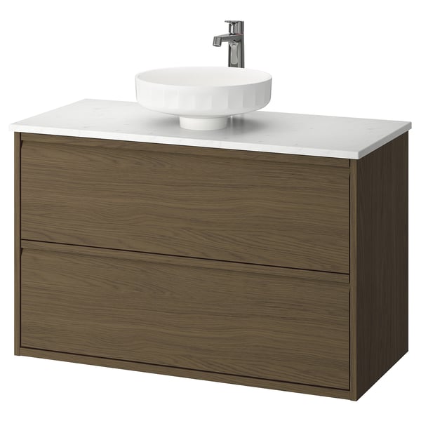 Modern moble de bany de paret de fusta fosca amb taulell blanc i lavabo rodó. Disseny minimalista.
