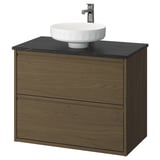 Tocador de bany modern, ÄNGSJÖN, de roure marró amb taulell negre, lavabo rodó i aixeta cromada.