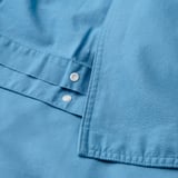Conjunt nòrdic blau clar amb tancament de botó, confeccionat en cotó suau i transpirable.