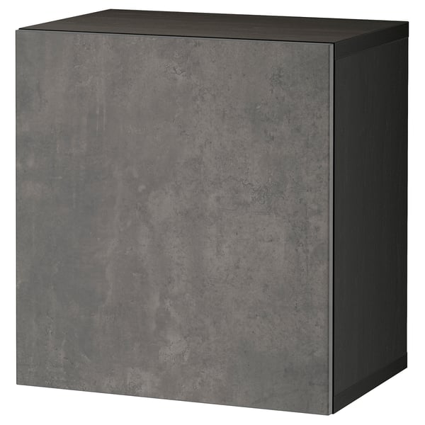 Un traster ikea BESTÅ de color gris fosc, de forma quadrada amb un disseny elegant i modern. Està fet de tauler de partícules i laminat.