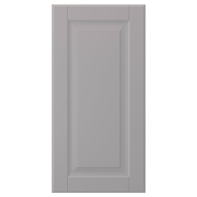 Una porta d'armari BODBYN grisa. Té una forma llisa i rectangular amb un disseny de panells bisellats i un acabat lacat.