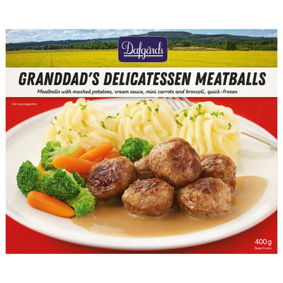 La caixa de mandonguilles de delicatessen de l'avi. Mostra mandonguilles, puré de patates, pastanagues i bròquil amb salsa.