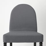 Cadira de menjador grisa elegant amb potes negres elegants, que ofereix comoditat i estil. Perfecte per a la decoració moderna de la llar.
