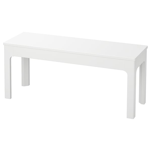 Banc rectangular blanc, disseny minimalista amb quatre potes.