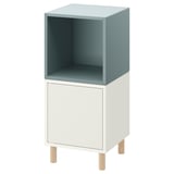 Cub d'emmagatzematge EKET, blau clar i blanc, forma quadrada oberta, quatre potes de fusta.