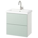 Tocador de bany modern verd-gris amb lavabo quadrat i aixeta platejada.