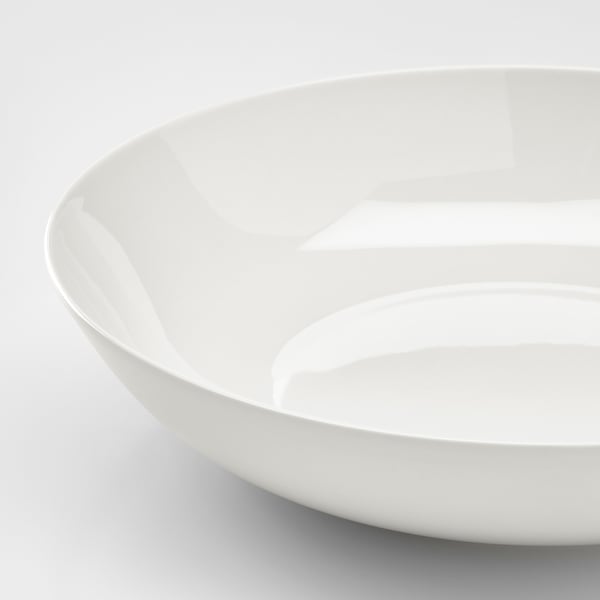 Primer pla d'un bol blanc elegant i llis amb un acabat brillant, que mostra la seva qualitat de porcellana fina.