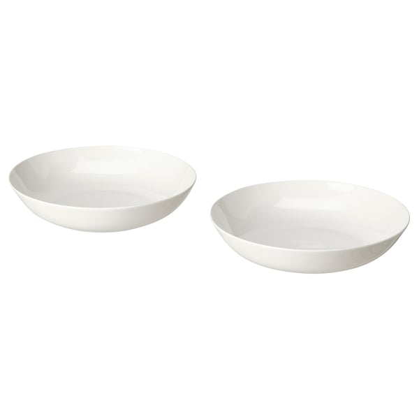 Dos bols de porcellana blanca, un una mica més gran que l'altre, amb formes suaus i orgàniques i dissenys senzills. Perfecte per servir o menjar.