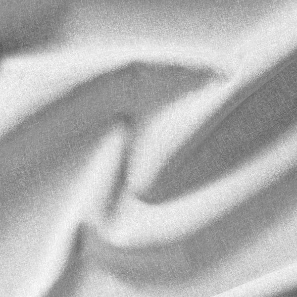 Primer pla de teixit de cotó, texturitzat amb subtils patrons de teixit, suaument drapejat, destacant la qualitat i la privacitat.