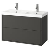 Lavabo doble gris fosc amb dos calaixos i lavabos blancs dobles.