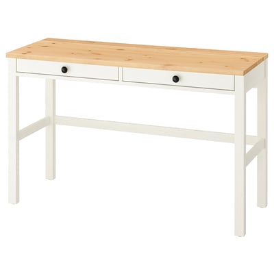 Un escriptori HEMNES de fusta blanca i clara amb dos calaixos i potes resistents.