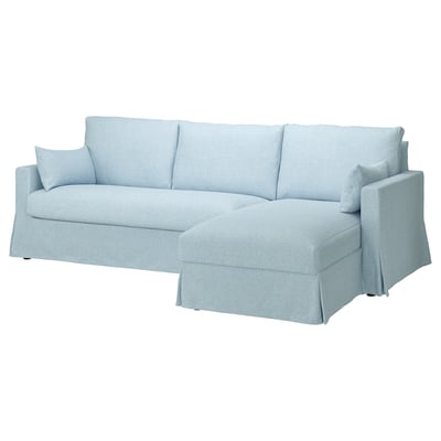 Sofà seccional blau amb chaise longue, polièster reciclat.