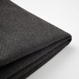 Primer pla: funda de coixí gris fosc d'alta qualitat amb teixit complex, cremallera llisa, perfecta per a ús a l'aire lliure.