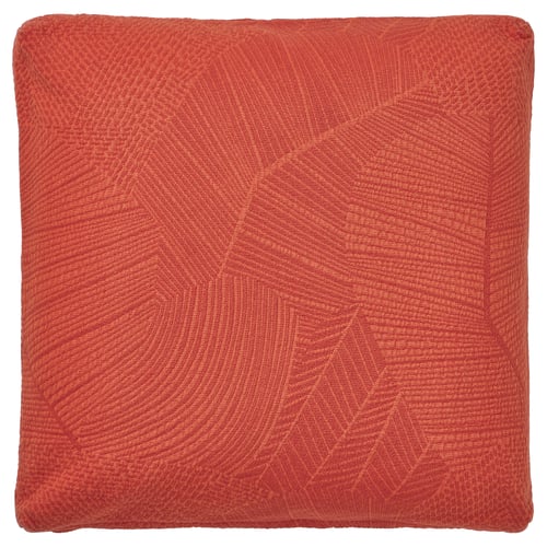 Funda de coixí quadrada vermell-taronja anomenada JÄTTEGRAN amb un patró frondós, amb un teixit jacquard texturitzat i cantonades robustes.