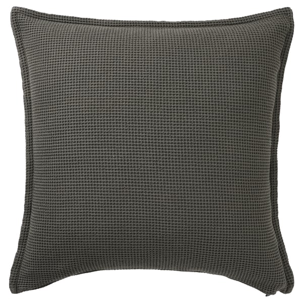 Coixí quadrat gris fosc, textura gofre, tancament amb cremallera.