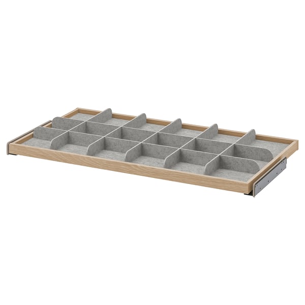 KOMPLEMENT: organitzador de calaixos de fusta amb insercions de feltre, forma rectangular, tons grisos i fusta.