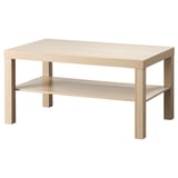 Una taula auxiliar LACK de fusta clara amb un sol prestatge. Té un disseny senzill i rectangular i està fabricat amb materials de fusta d'enginyeria.
