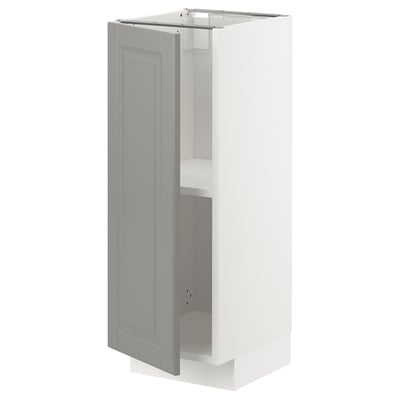 Moble de cuina gris suau, METOD, disseny vertical prim, vores de portes bisellades, interior blanc, prestatge ajustable.