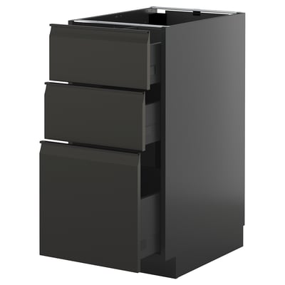 Armari de cuina ikea METOD negre amb tres calaixos oberts, disseny modern i elegant.