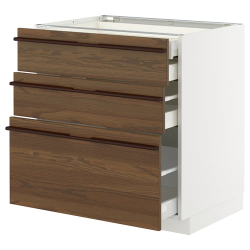 Un armari de cuina ikea METOD amb tres calaixos de fusta de color marró fosc i blanc, amb tiradors elegants.