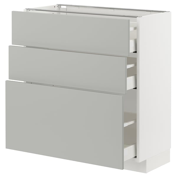 Un armari de cuina METOD blanc amb tres calaixos. El disseny net i modern inclou calaixos de panell pla amb un acabat elegant de color gris clar.