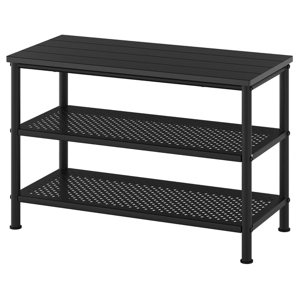 Un sabater PINNIG rectangular negre amb tapa de fusta i prestatges de malla metàl·lica.
