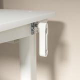 Detall de l'escriptori blanc: frontissa metàl·lica ajustable, clip de plàstic, cargols.