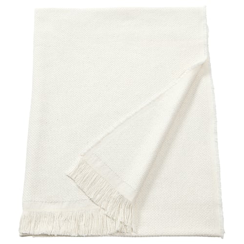 Una manta blanca rectangular RÖNNBÄRSMAL amb vores amb serrells, feta d'un material suau i texturat.